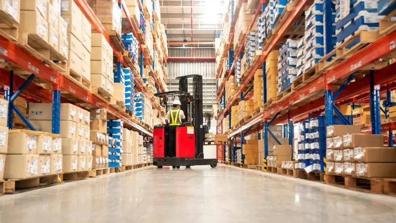 Racking aisles and palletized stock inside a distribution warehouse protected by pest monitoring