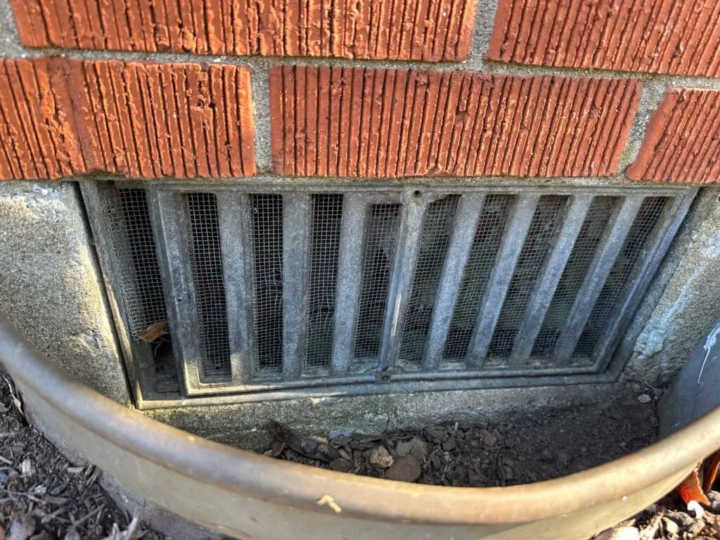 Foundation Vents like the one on this crawlspace home are the perfect entry point for rodents in Lexington, KY.