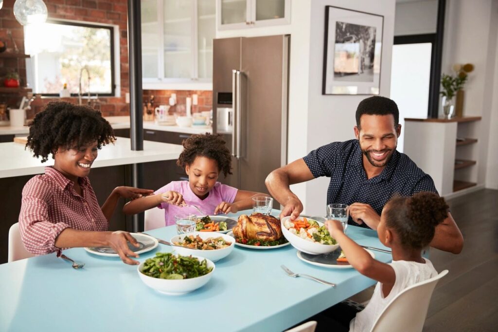 Happy pest-free family enjoying a meal at home